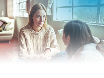 What's Your Asthma Reality? Image shows a mother having a conversation with her daughter.